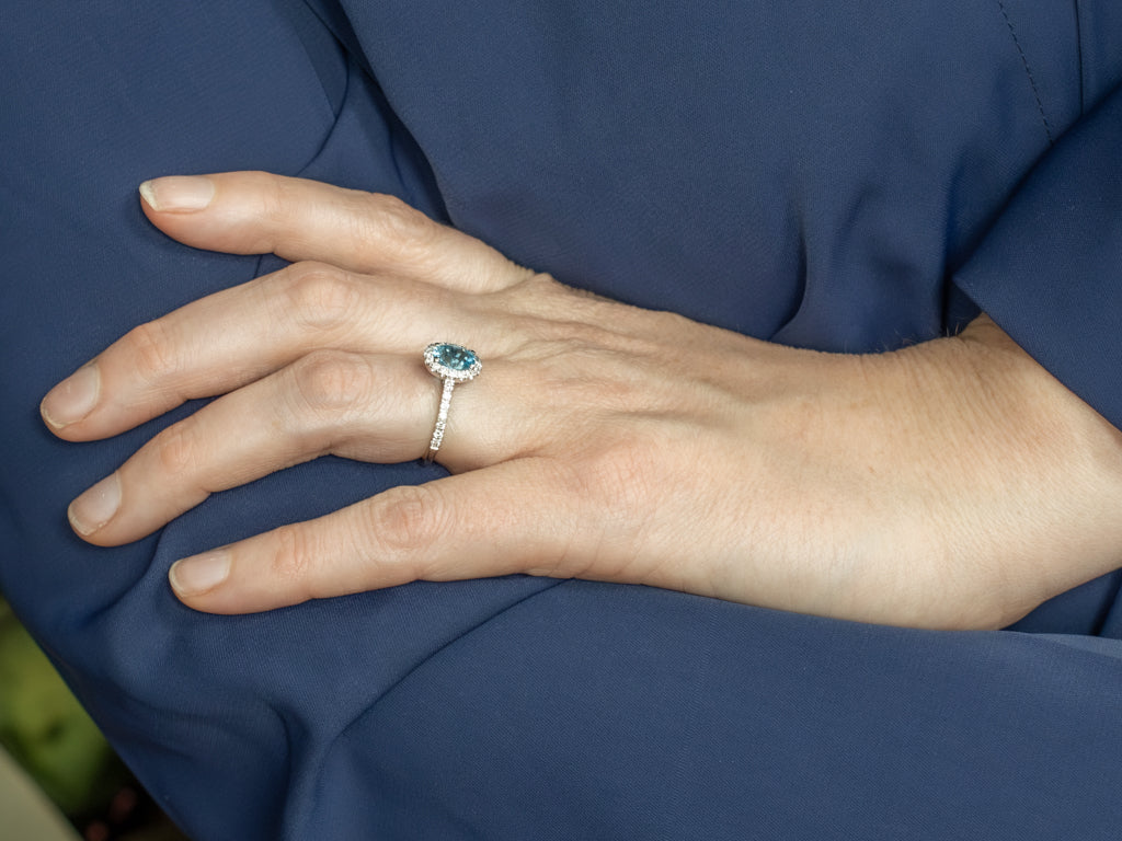 Modern Blue Topaz and Diamond Halo Ring