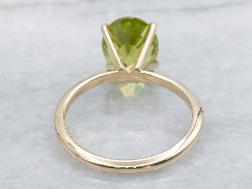 Oval-Cut Peridot Yellow Gold Solitaire Ring