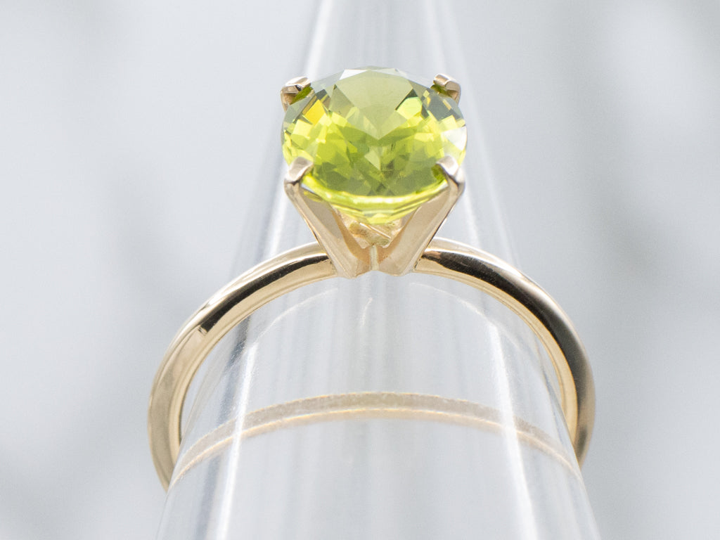 Oval-Cut Peridot Yellow Gold Solitaire Ring