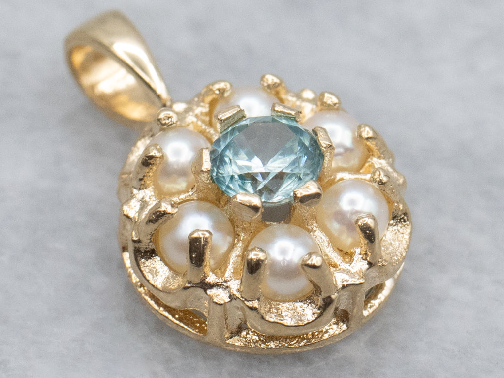Pretty Blue Zircon and Pearl Halo Gold Pendant