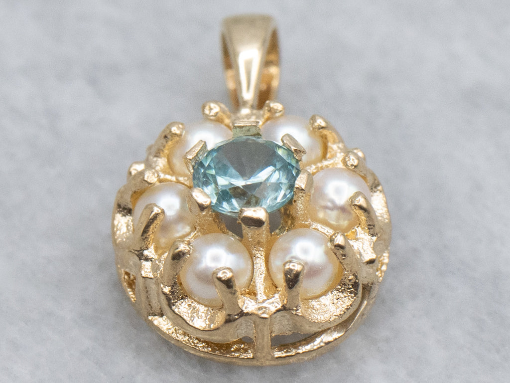 Pretty Blue Zircon and Pearl Halo Gold Pendant