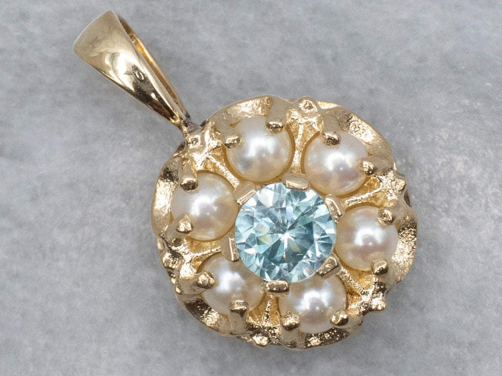 Pretty Blue Zircon and Pearl Halo Gold Pendant
