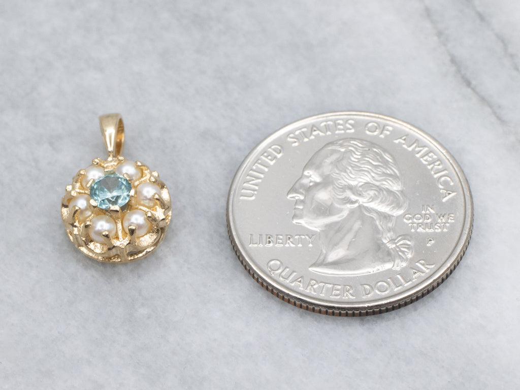 Pretty Blue Zircon and Pearl Halo Gold Pendant