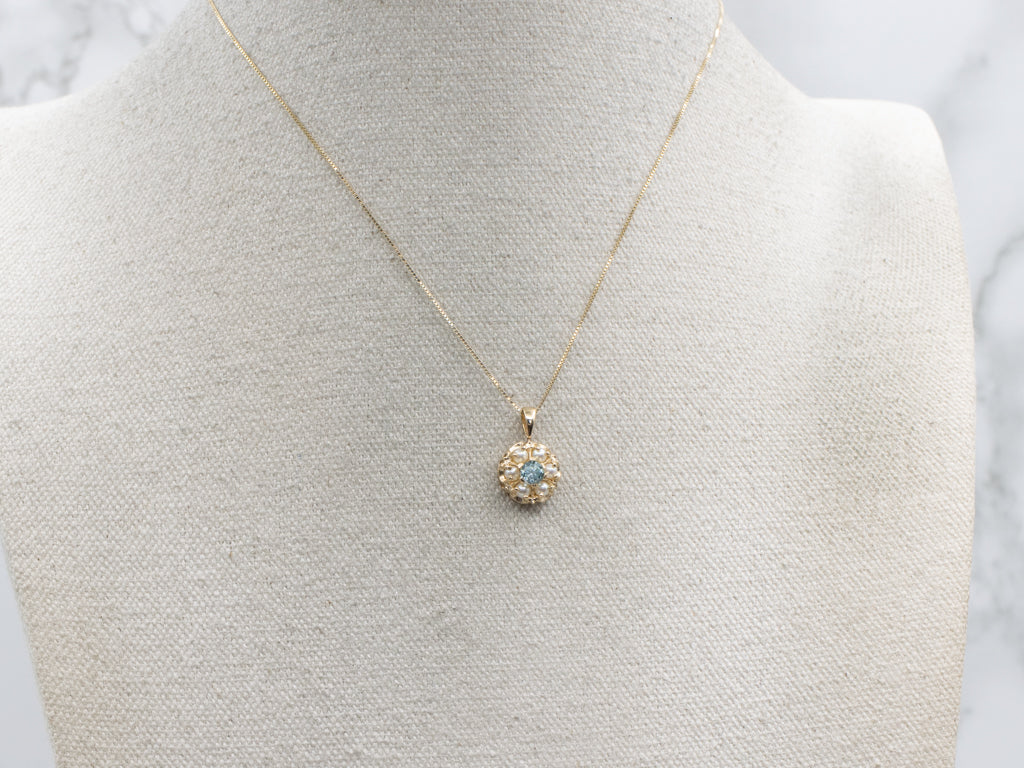 Pretty Blue Zircon and Pearl Halo Gold Pendant