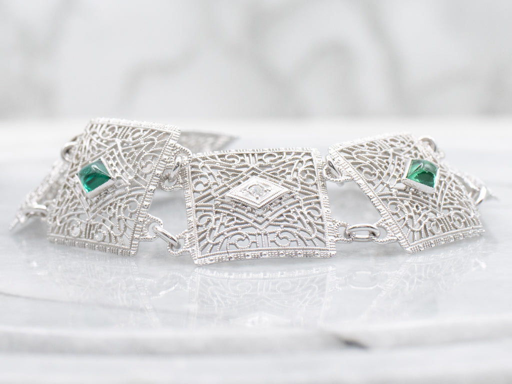 Art Deco Era Diamond and Emerald Doublet Floral Filigree Panel Link Bracelet