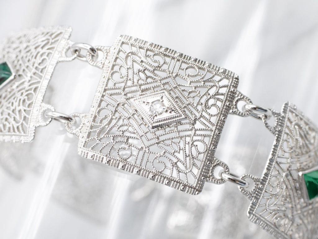 Art Deco Era Diamond and Emerald Doublet Floral Filigree Panel Link Bracelet