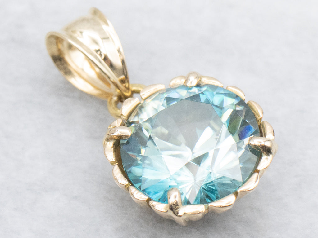 Blue Zircon Solitaire Pendant in Scalloped Gold Setting