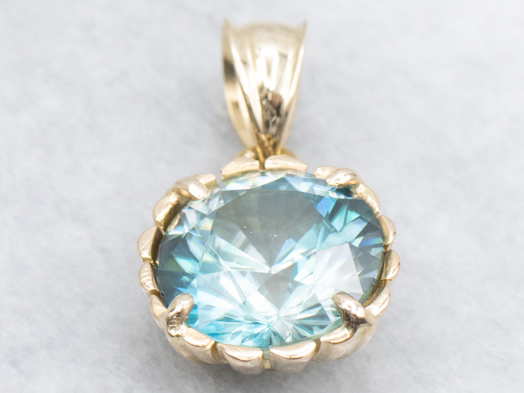 Blue Zircon Solitaire Pendant in Scalloped Gold Setting
