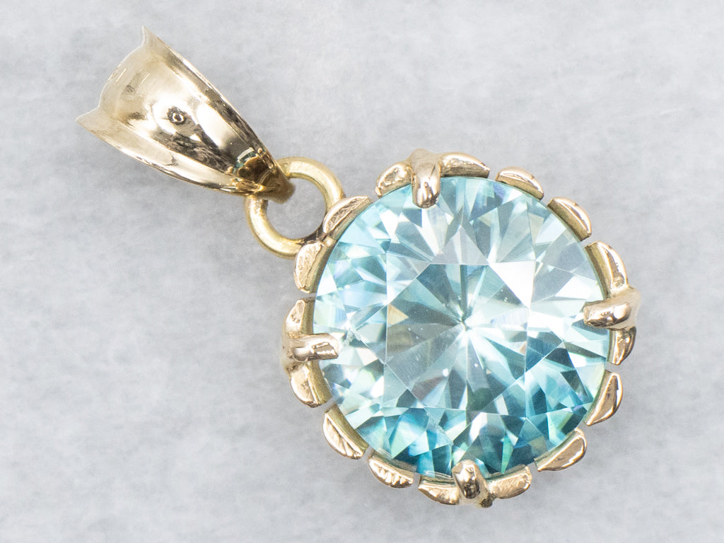 Blue Zircon Solitaire Pendant in Scalloped Gold Setting
