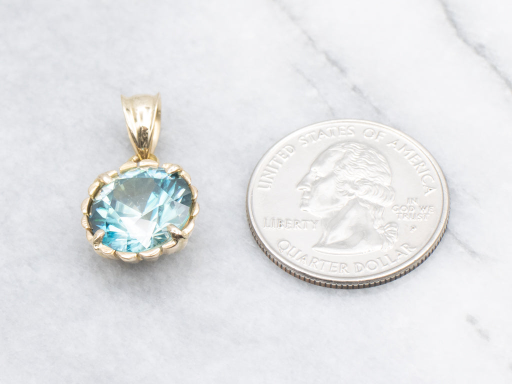 Blue Zircon Solitaire Pendant in Scalloped Gold Setting