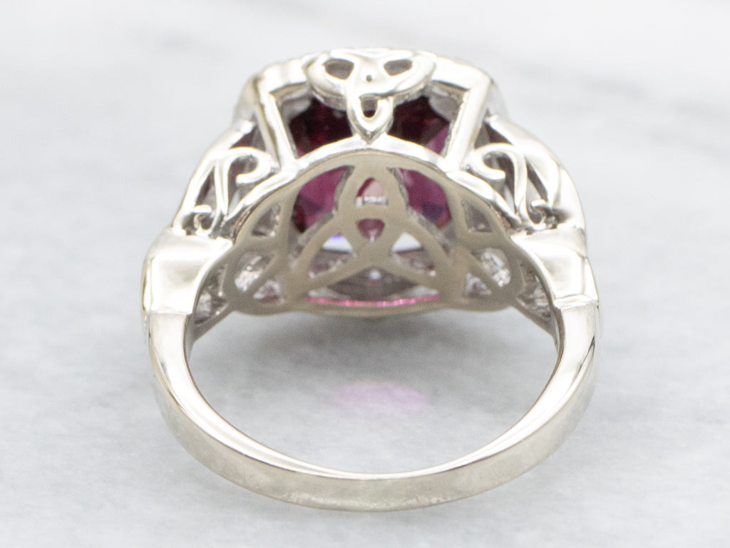 Garnet and Diamond Halo White Gold Ring with Celtic Trinity Knot
