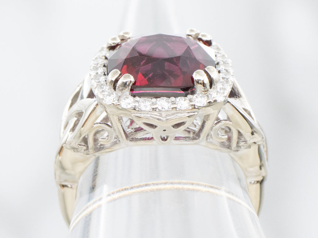 Garnet and Diamond Halo White Gold Ring with Celtic Trinity Knot