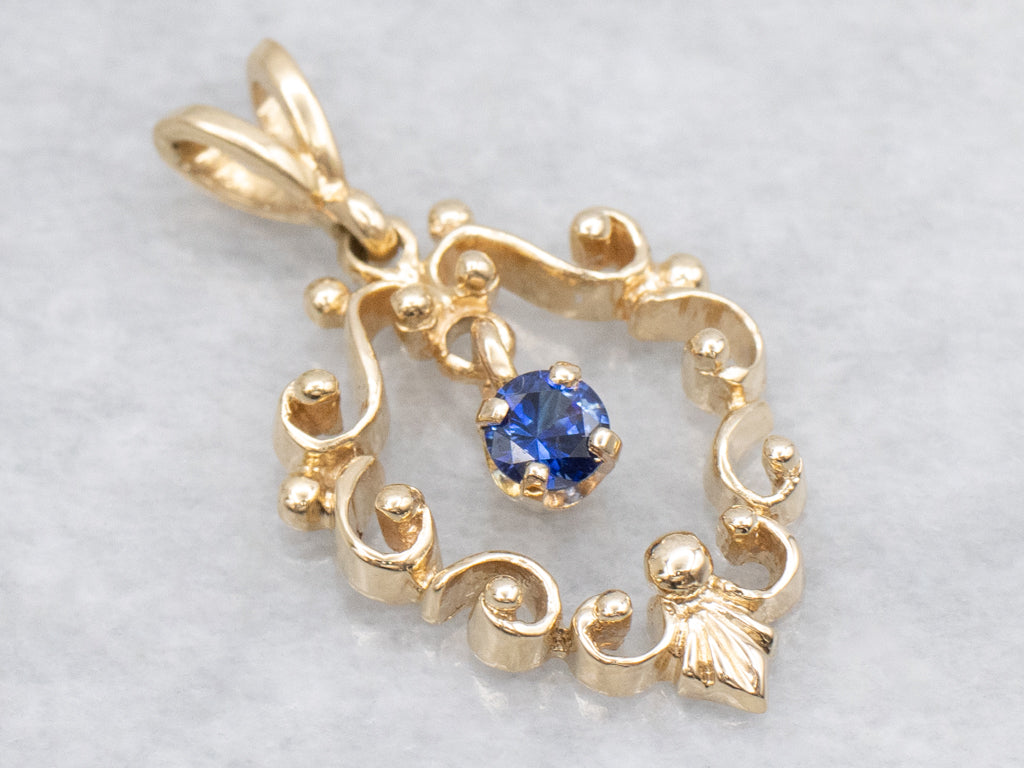 Scrolling Yellow Gold Pendant with Swinging Sapphire Drop