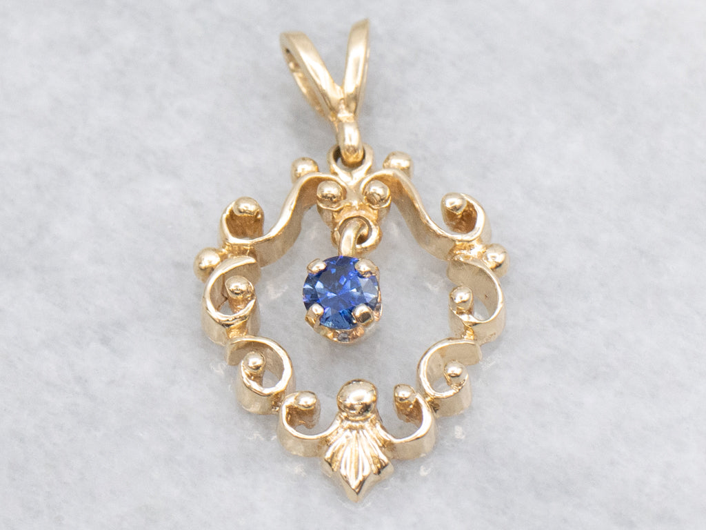 Scrolling Yellow Gold Pendant with Swinging Sapphire Drop