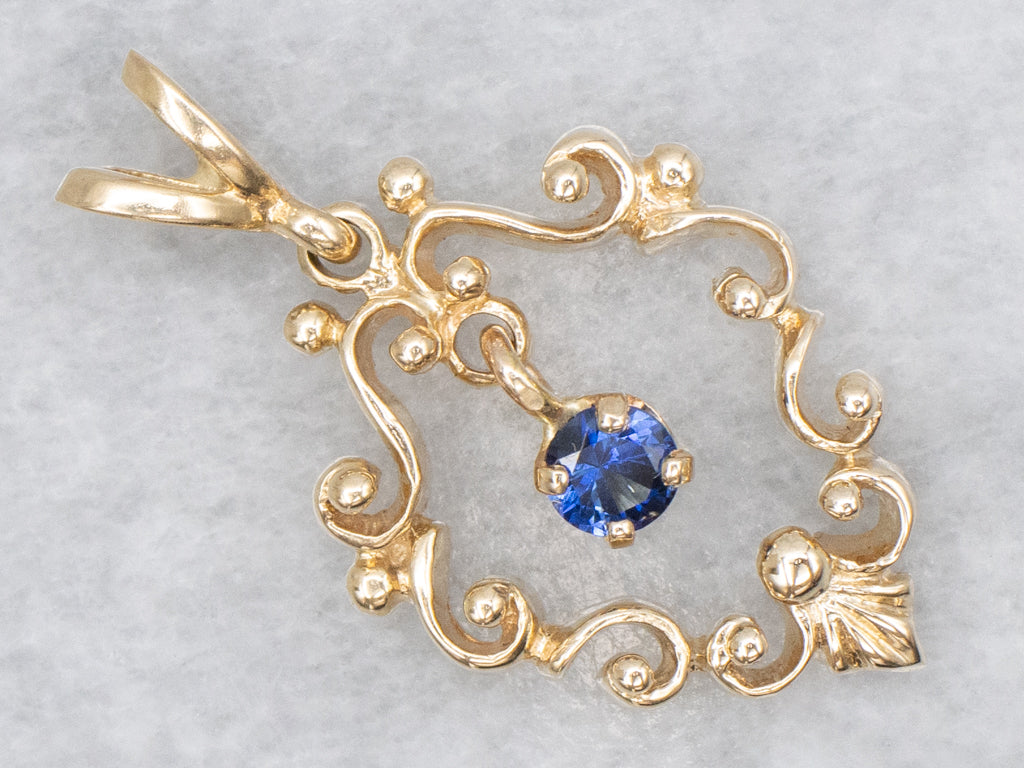 Scrolling Yellow Gold Pendant with Swinging Sapphire Drop