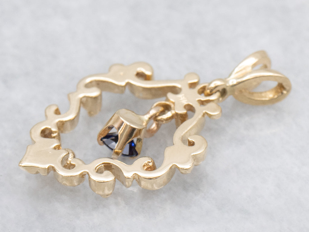 Scrolling Yellow Gold Pendant with Swinging Sapphire Drop