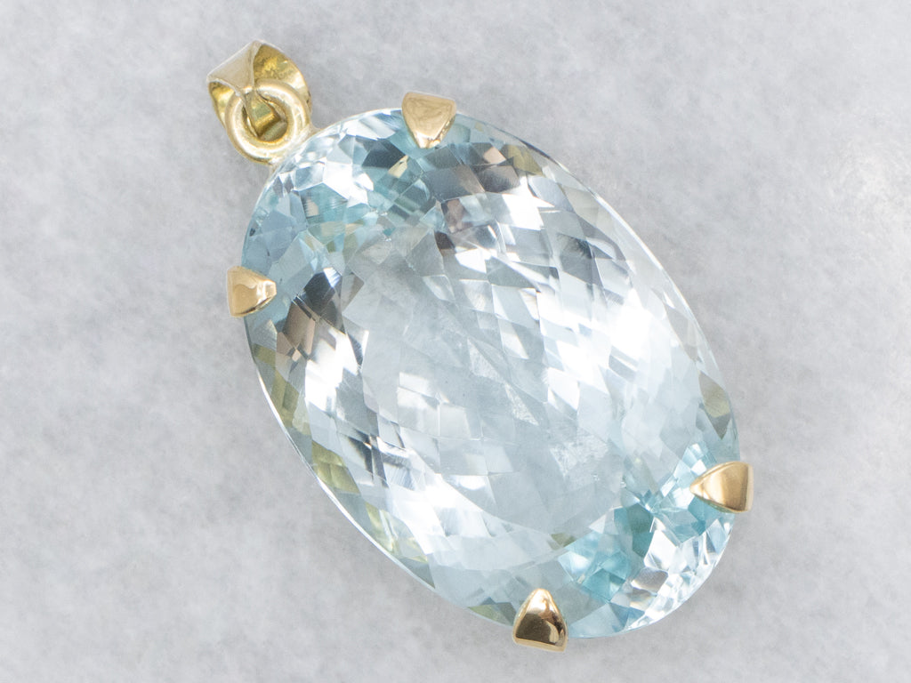 Oversized Blue Topaz and Gold Cocktail Pendant