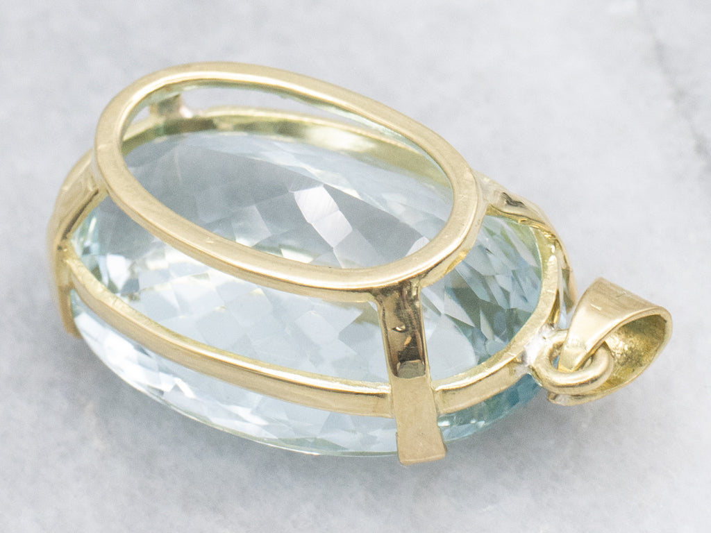Oversized Blue Topaz and Gold Cocktail Pendant