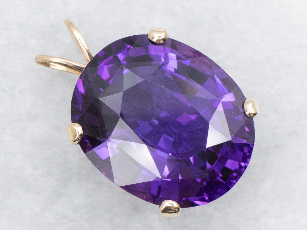 Four-Prong Oval-Cut Amethyst and Gold Cocktail Pendant