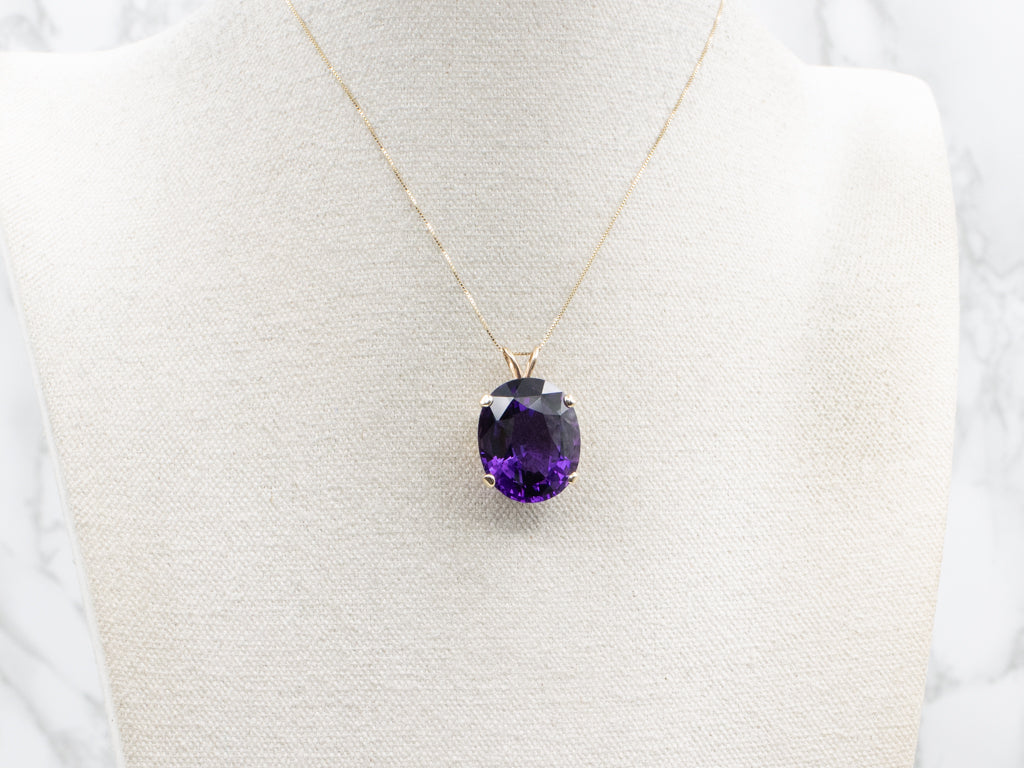 Four-Prong Oval-Cut Amethyst and Gold Cocktail Pendant
