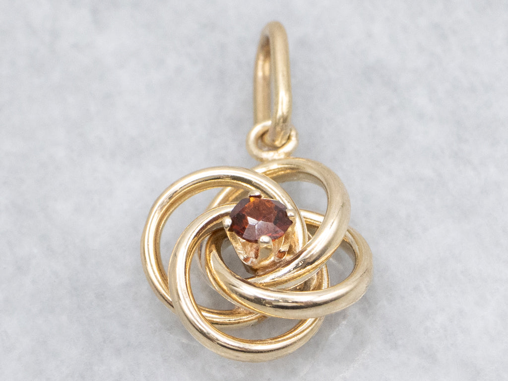 Yellow Gold Garnet Lovers Knot Pendant
