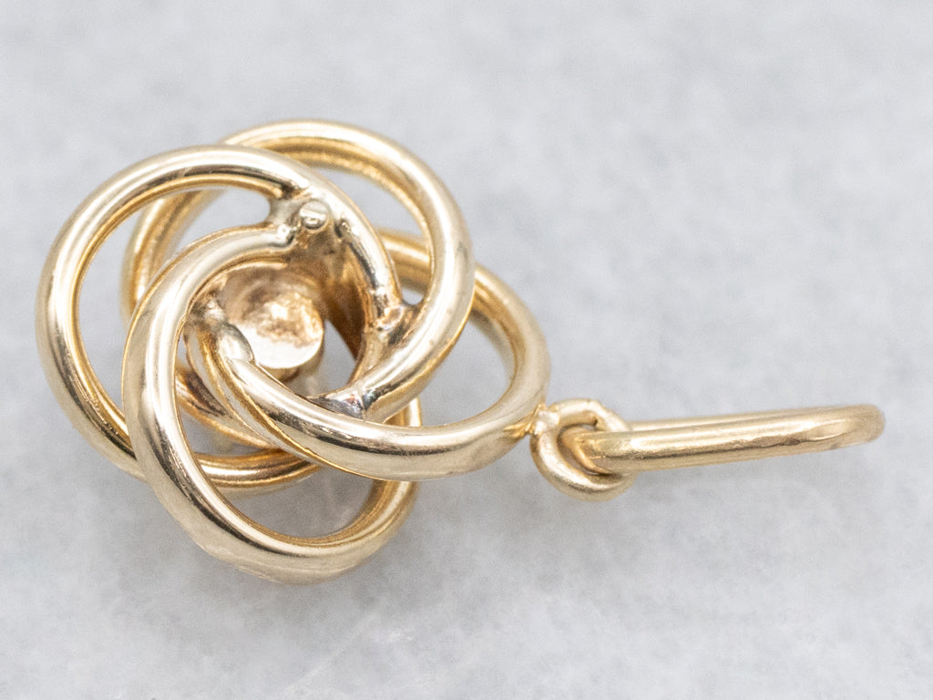 Yellow Gold Garnet Lovers Knot Pendant