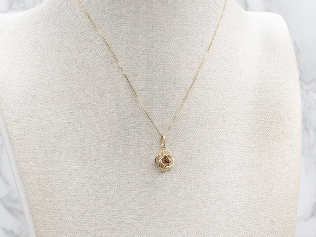Yellow Gold Garnet Lovers Knot Pendant