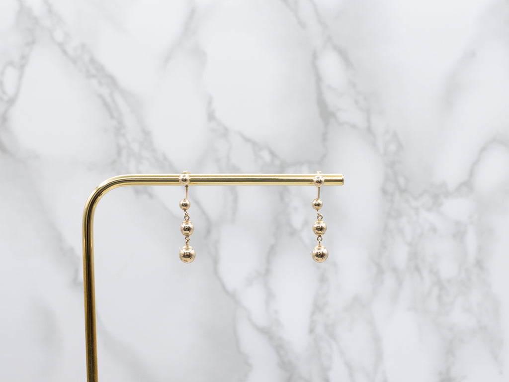 Polished Ball Yellow Gold Stud Earrings with Graduated Ball Drop Backs
