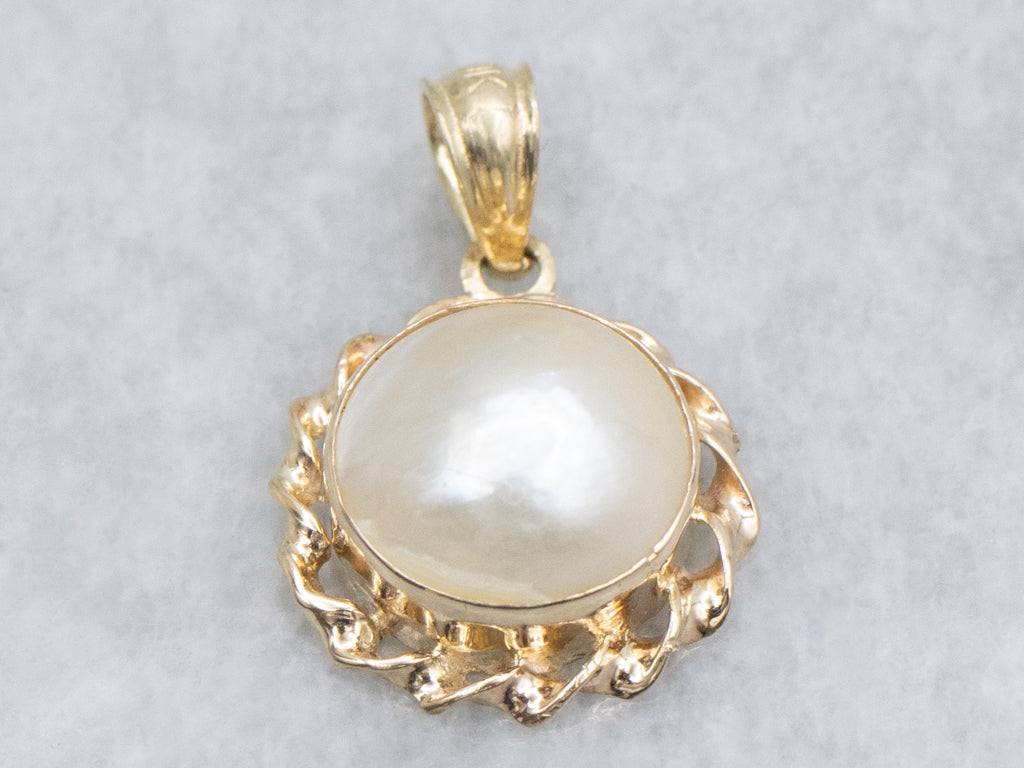 Mabe Pearl and Gold Pendant with Twisted Setting