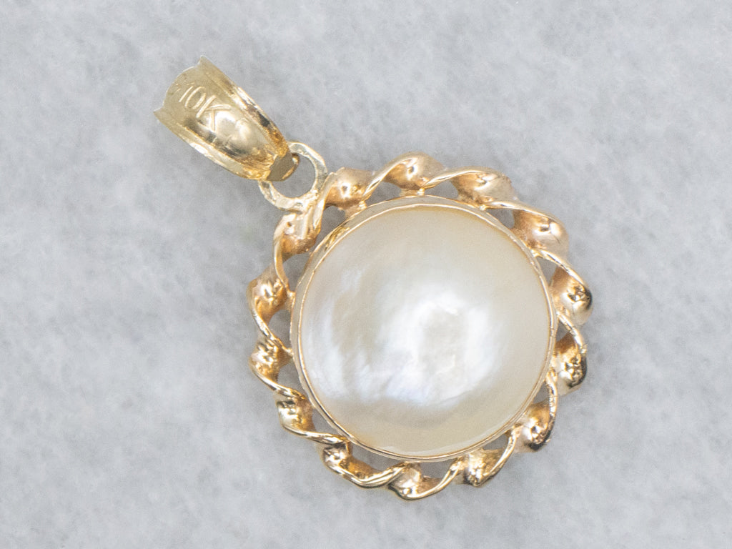 Mabe Pearl and Gold Pendant with Twisted Setting