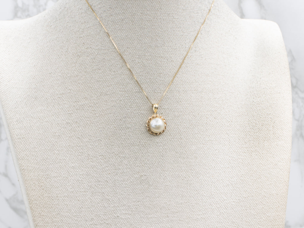 Mabe Pearl and Gold Pendant with Twisted Setting
