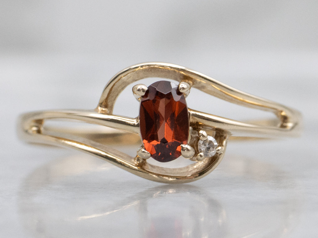 Vintage Gold and Garnet Bypass Ring with Diamond Accent