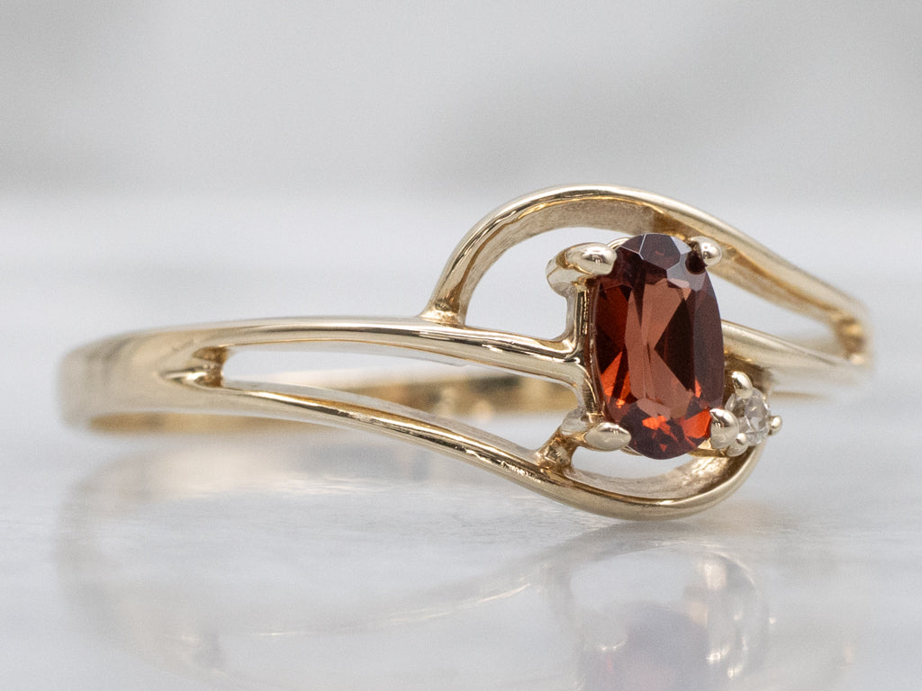 Vintage Gold and Garnet Bypass Ring with Diamond Accent
