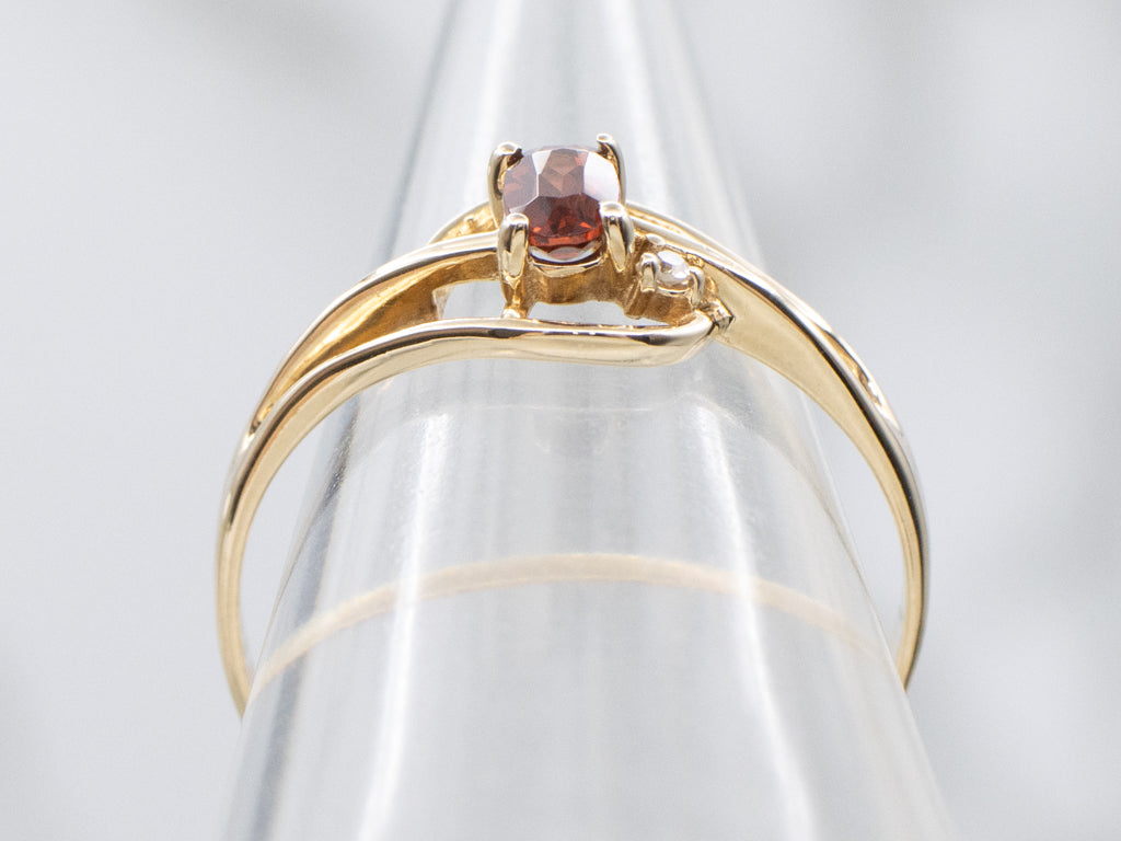 Vintage Gold and Garnet Bypass Ring with Diamond Accent