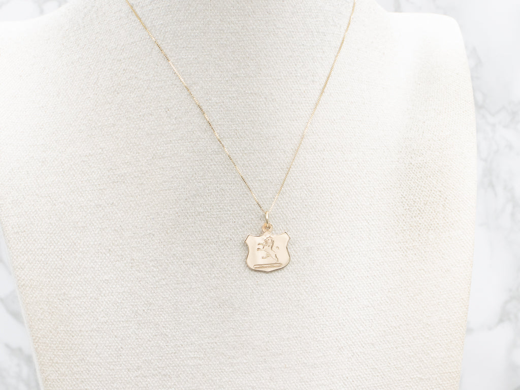 Engraved Gold Lion Shield Pendant