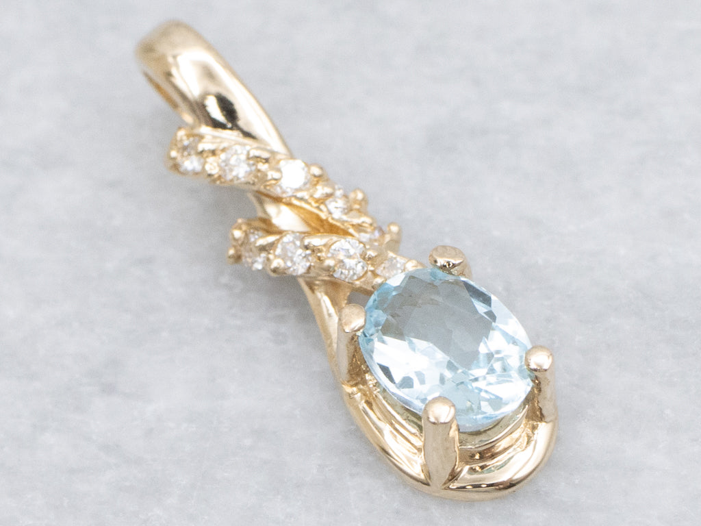 Blue Topaz and Diamond Twisting Gold Pendant