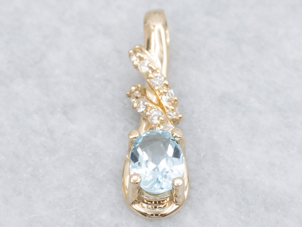 Blue Topaz and Diamond Twisting Gold Pendant