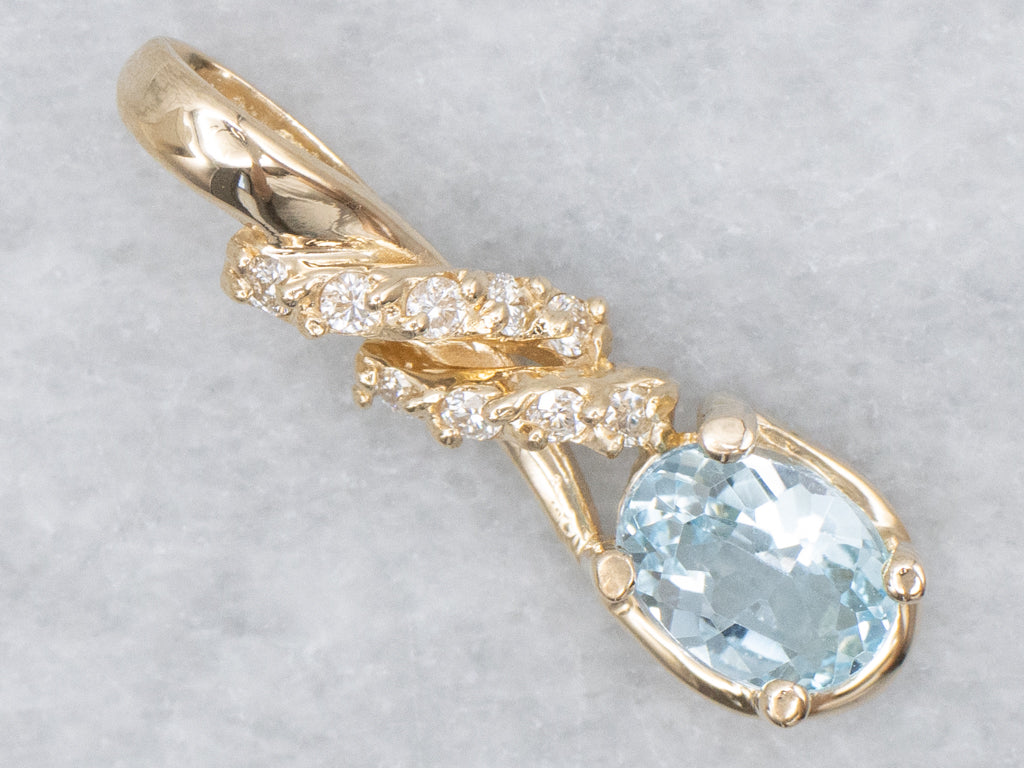 Blue Topaz and Diamond Twisting Gold Pendant