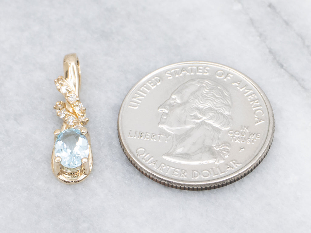 Blue Topaz and Diamond Twisting Gold Pendant