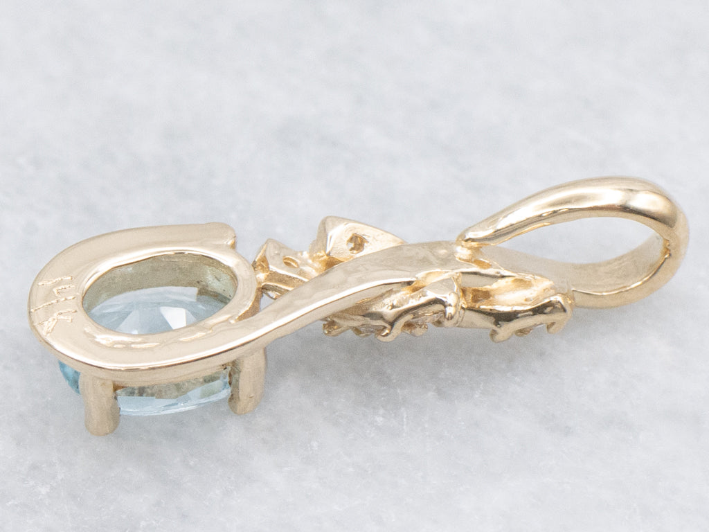 Blue Topaz and Diamond Twisting Gold Pendant