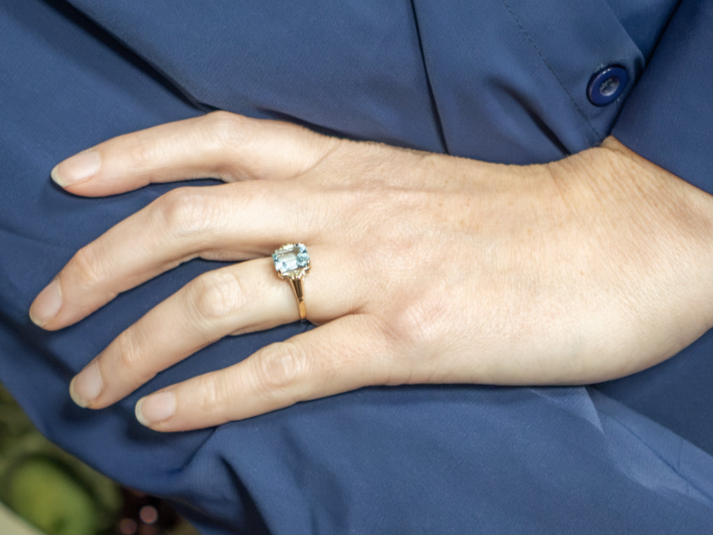 Emerald-Cut Blue Topaz and Gold Solitaire Ring