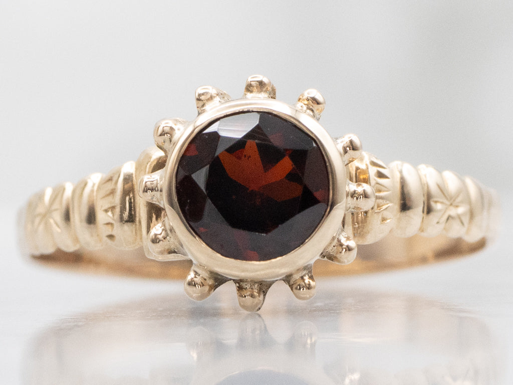 Antique Bezel-Set Garnet Solitaire Starburst Ring