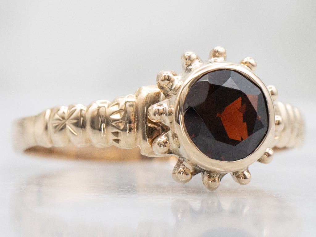 Antique Bezel-Set Garnet Solitaire Starburst Ring