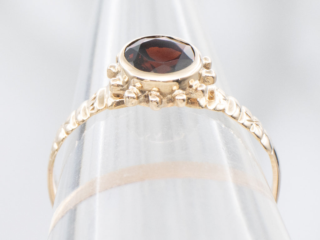 Antique Bezel-Set Garnet Solitaire Starburst Ring