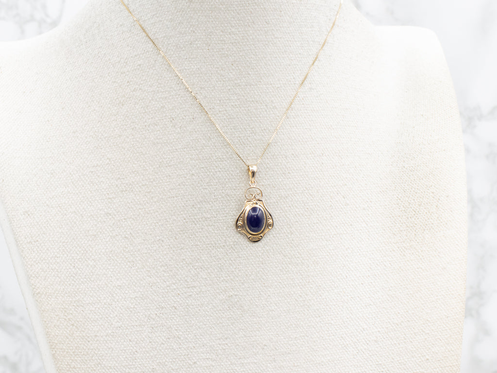 Scrolling Yellow Gold Purple Glass Cabochon Pendant