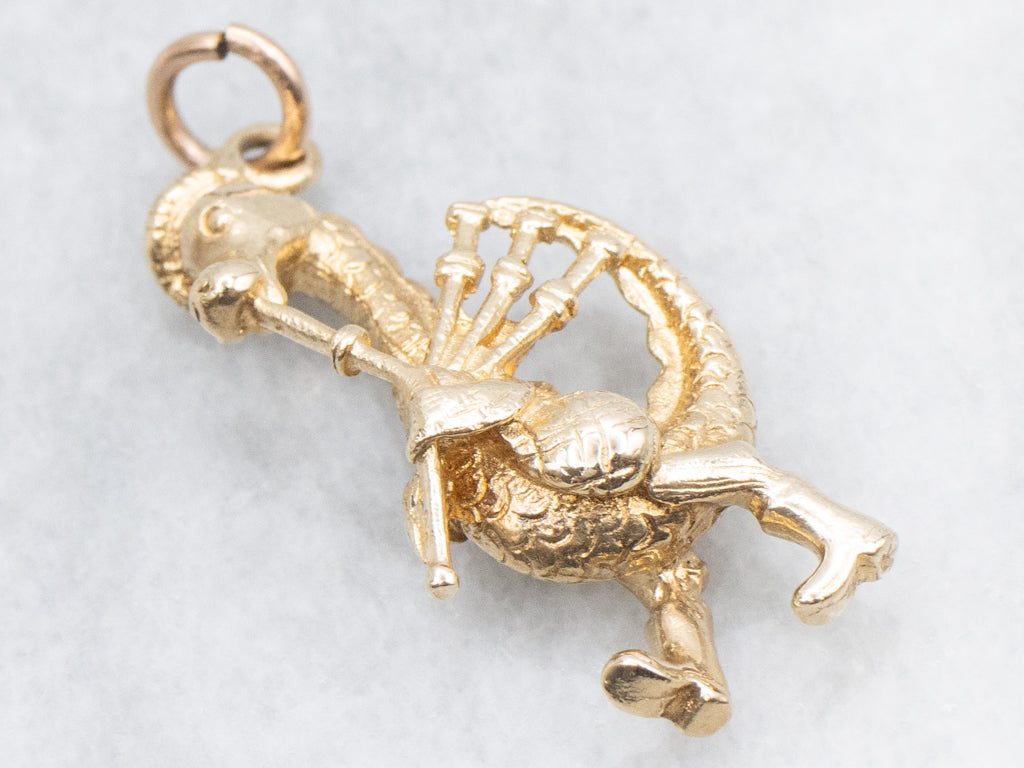 Gold Nessie Playing Bagpipes Charm