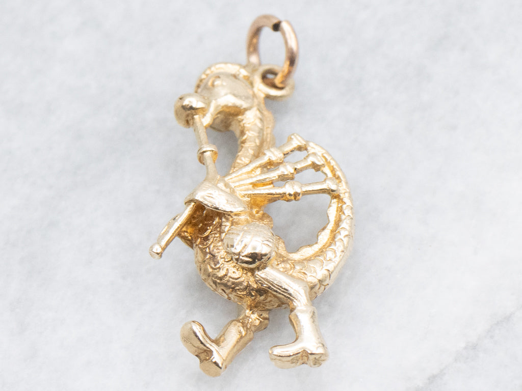 Gold Nessie Playing Bagpipes Charm
