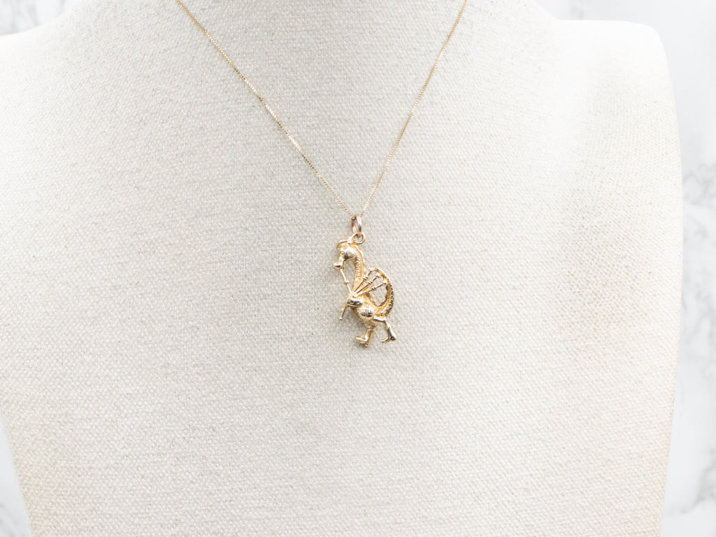 Gold Nessie Playing Bagpipes Charm