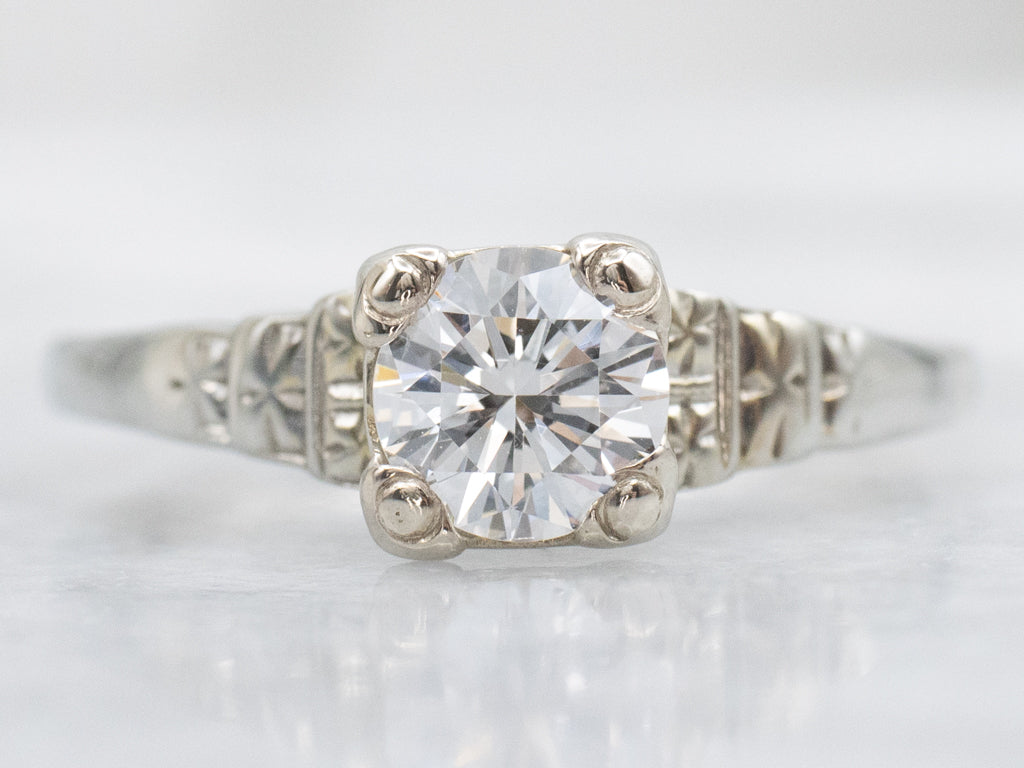 Circa 1930s Diamond Solitaire Engagement Ring with Forget-Me-Not Details