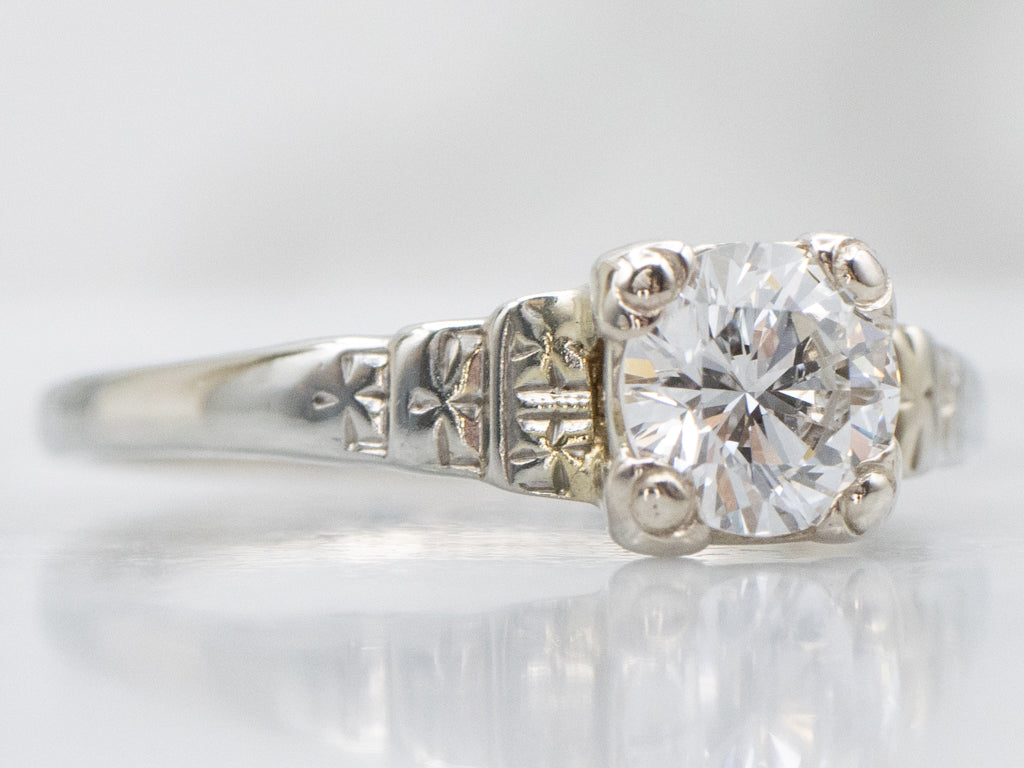 Circa 1930s Diamond Solitaire Engagement Ring with Forget-Me-Not Details